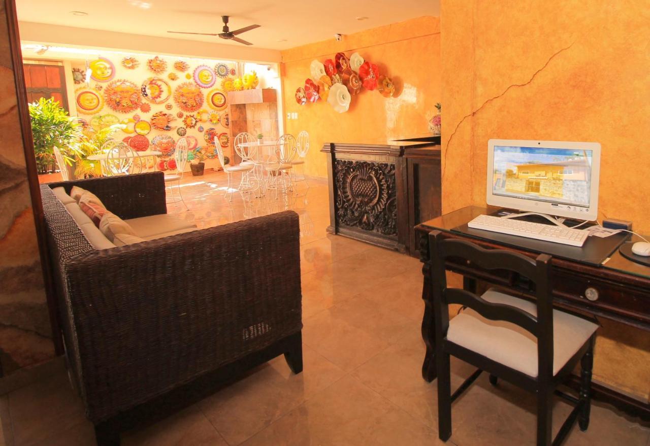 Papagayo Hotel Boutique Playa del Carmen Eksteriør bilde The interior of a typical hotel room